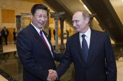 国家主席习近平同普京总统共见记者